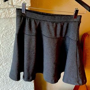 Charcoal grey mini skirt. Size 4.